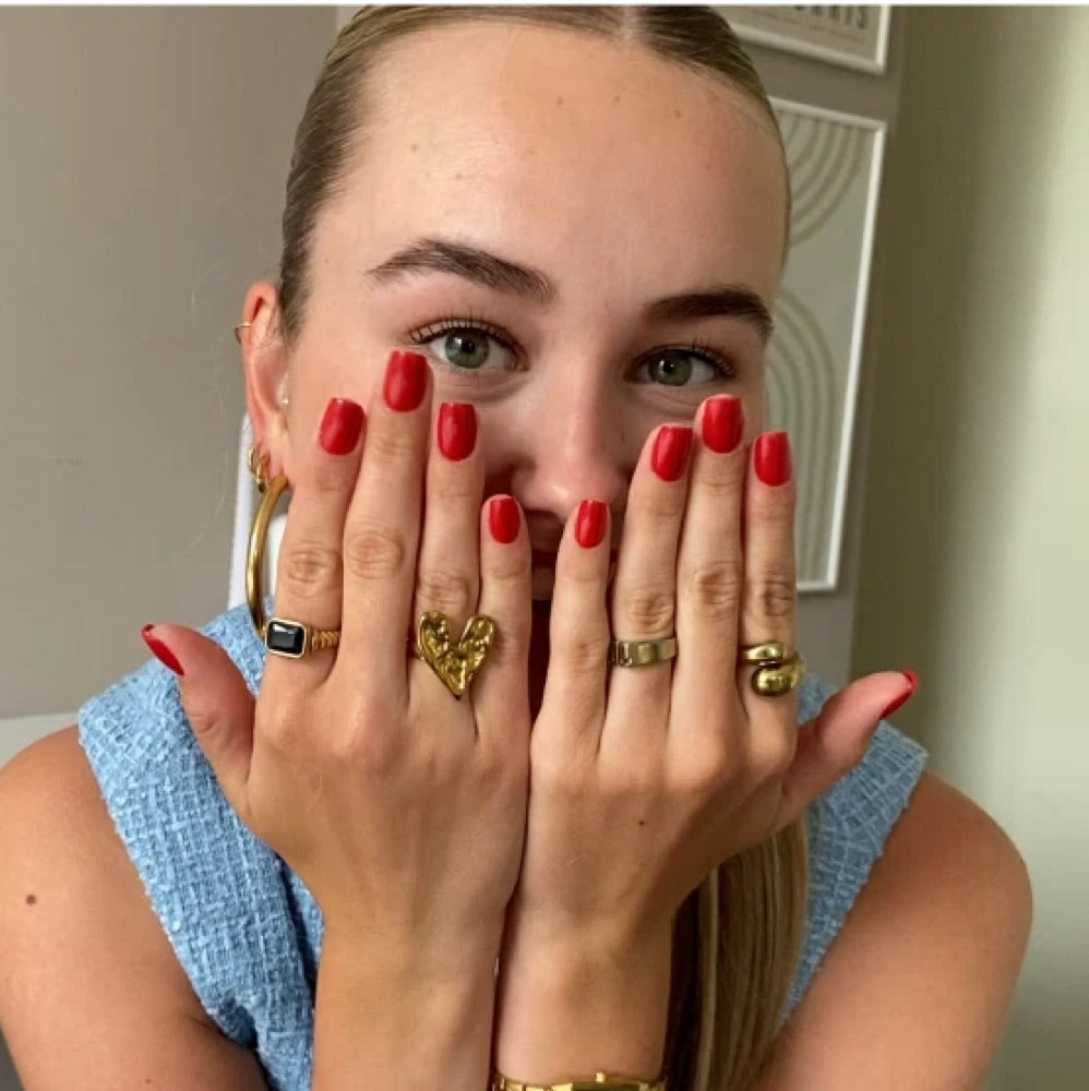 Customer wearing dark red press ons